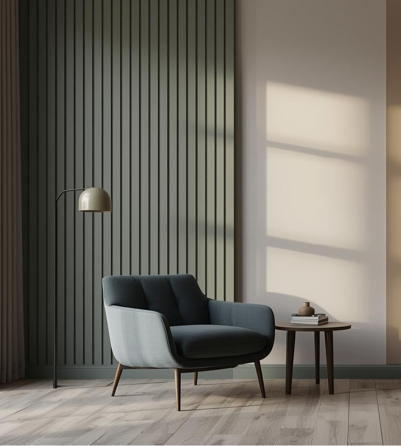 Modern living room with a gray armchair, side table, and decorative items.