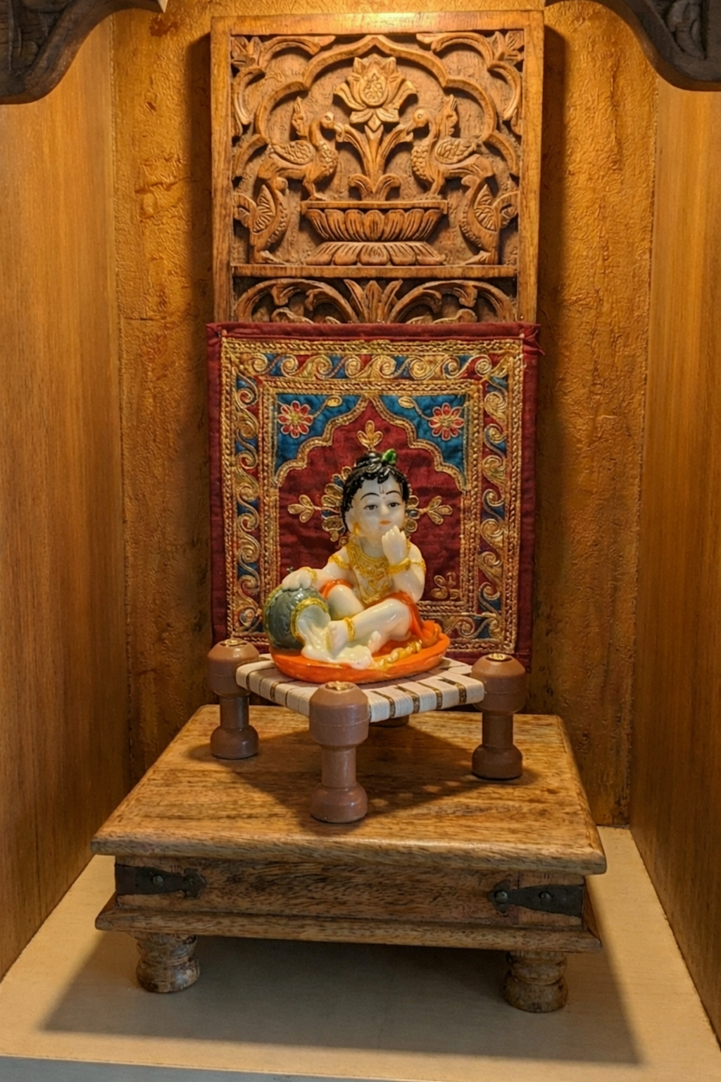 Little Krishna Eating Butter on Charpai – Handcrafted Polyresin Janmashtami Decor