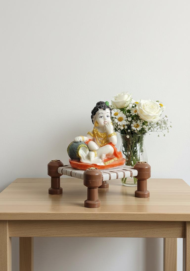 Little Krishna Eating Butter on Charpai – Handcrafted Polyresin Janmashtami Decor