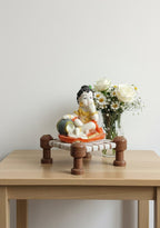Little Krishna Eating Butter on Charpai – Handcrafted Polyresin Janmashtami Decor